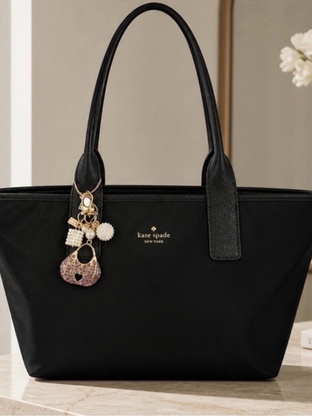 kate spade black tote with charm pendant